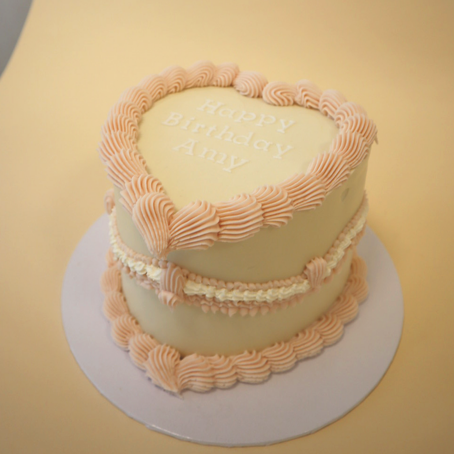 Pink and neutral heart vintage cake, with message 'happy birthday Amy' message. 